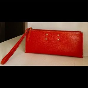 Kate Spade brilliant orange wristlet